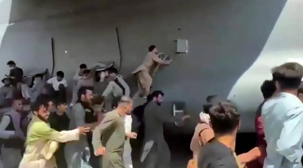 Taliban blame US for airport chaos as Afghans face 'impossible' race to flee