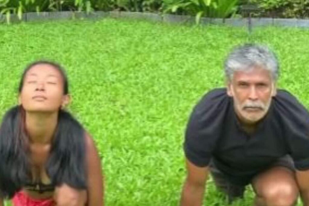 Watch: Milind Soman Performs Surya Namaskar with Wife Ankita Konwar on Lush Green Surface