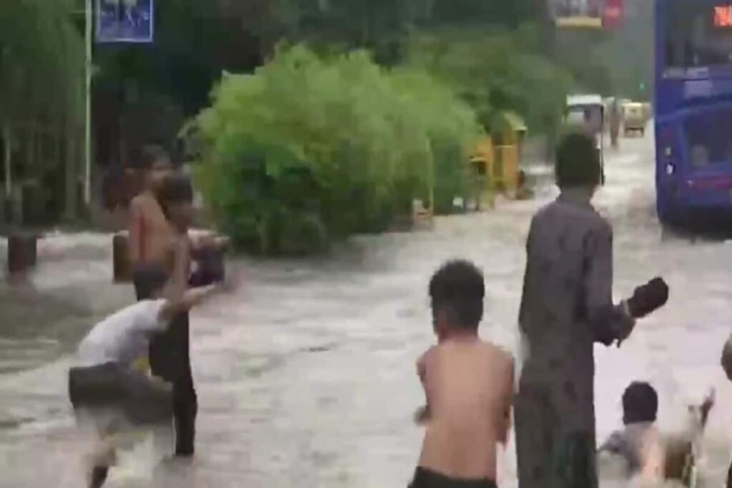 WATCH: After Heavy Downpour, Children Seen Swimming, Playing on Flooded Delhi Streets