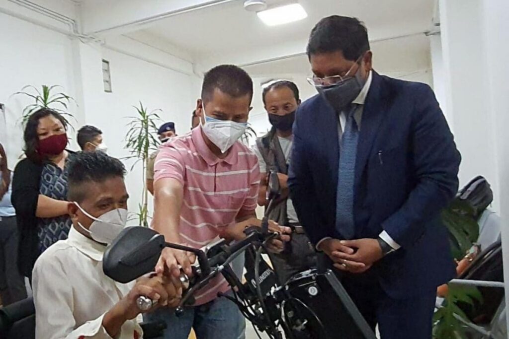 Moved By His Circumstances, CM Conrad Gifts Motorised Wheelchair Vehicle to Meghalaya Entrepreneur