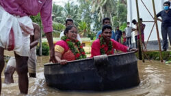 Kerala rains: bride, groom get married after reaching flooded hall in a cooking vessel