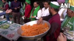 People at Ghazipur border distribute 'jalebis' after PM Modi repeals Farm laws
