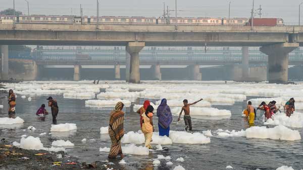 In pics: Devotees stand knee-deep in toxic foam in Yamuna for Chhath Puja