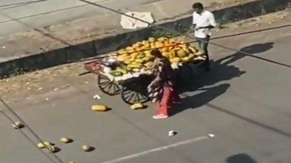 Video: Why is this woman furiously throwing papayas on the ground