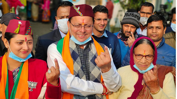 Uttarakhand CM Dhami flaunts scarves with BJP symbol; AAP says election code violation