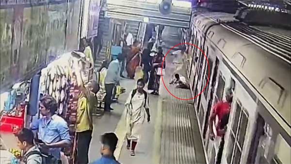 Watch: Woman saved by alert guard after she falls off moving train in Mumbai