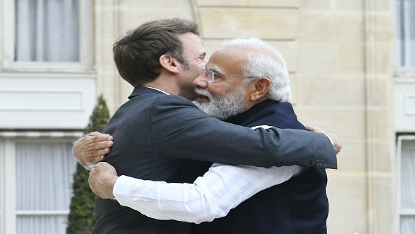 PM Modi gets warm hug from French President Emmanuel Macron upon arrival in France