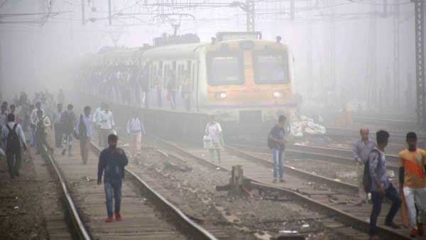 Torrid Monday morning in Mumbai: People walk to office as trains report delays