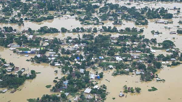 Assam floods: Locals take shelter on highways in Nagaon; Silchar under water for 5th day