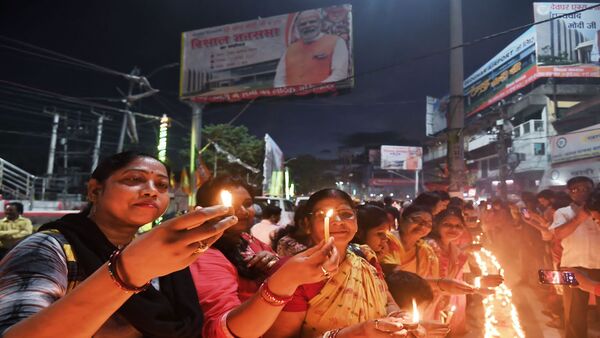 Jharkhand: Festive mood in Deoghar as people light diyas ahead of PM Modi's visit