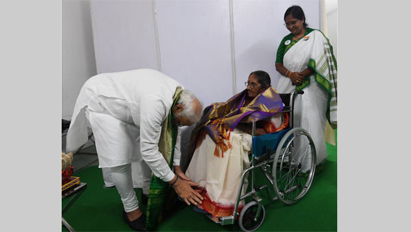 PM Modi meets family of freedom fighter Pasala Krishna Murthy, touches feet of his 90-year-old daughter