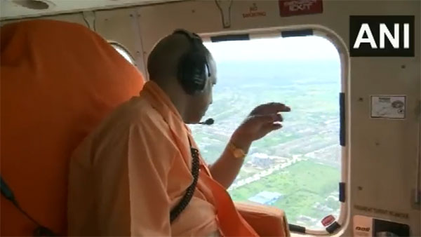 UP CM Adityanath conducts aerial survey of Kanwar Yatra | VIDEO