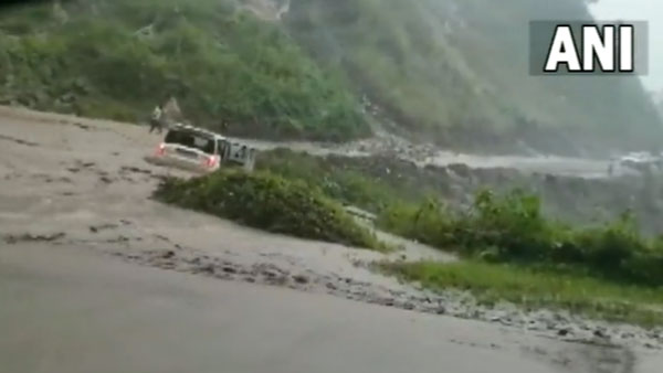 Scorpio car swept by flash floods in AP even as driver tried to steer it away | WATCH