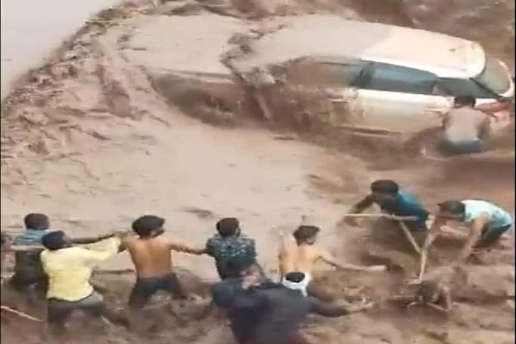An Overflowing River, a Rope & Several Locals: How a Woman Was Rescued as Her Car Got Stuck | Video