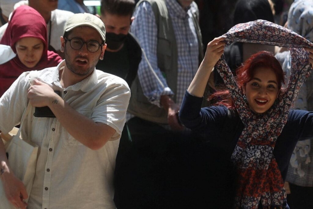 Iran Govt's Tech to Scan Women without Hijab Sends Warning SMSs to Long-Haired Men