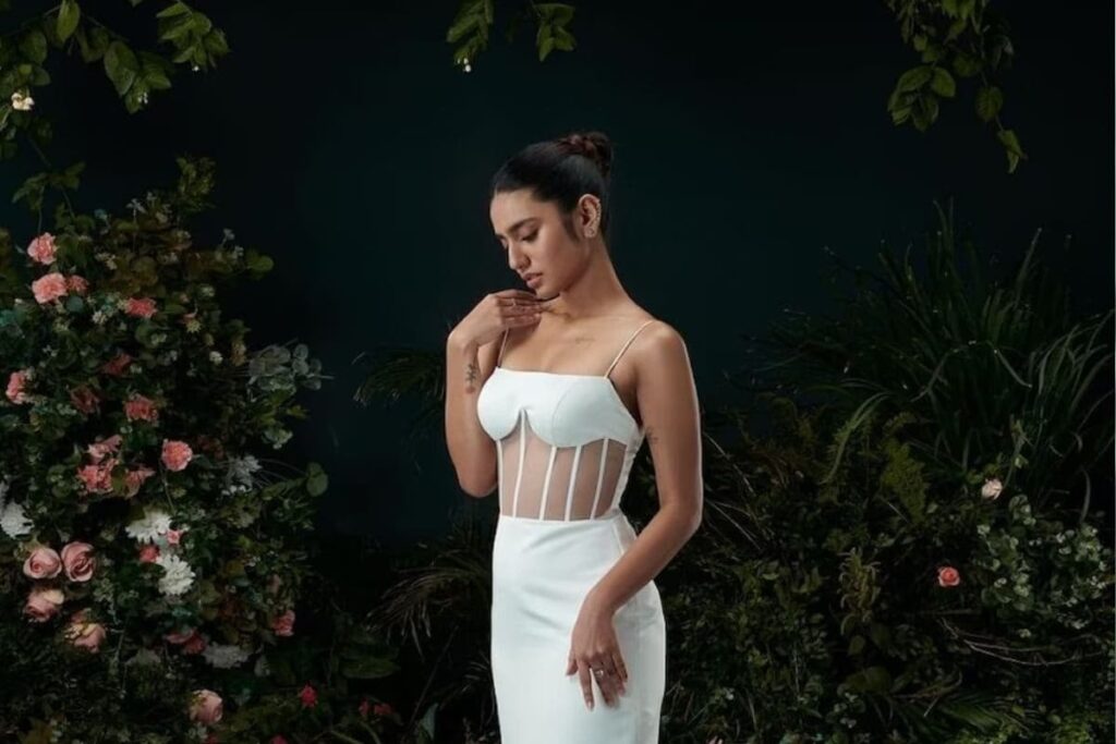 Actress Priya Prakash Varrier Trolled For Bold Pictures In White Corset Dress