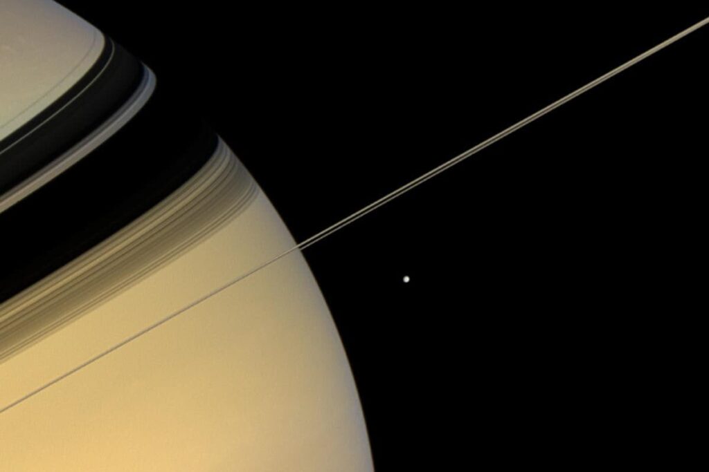 NASA’s Cassini Spacecraft Captures Stunning Pic Of Saturn And Its Moon Mimas