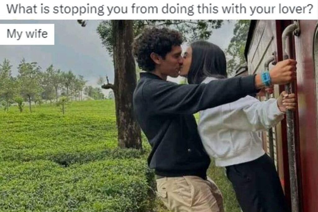 'What's Stopping You?': Viral Pic of Couple Kissing While Hanging on Train Gets Hilarious Replies