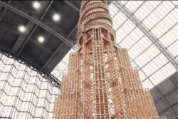 Artists Build World's Tallest Wooden Toy Block Tower Only To Crash It In Domino Effect