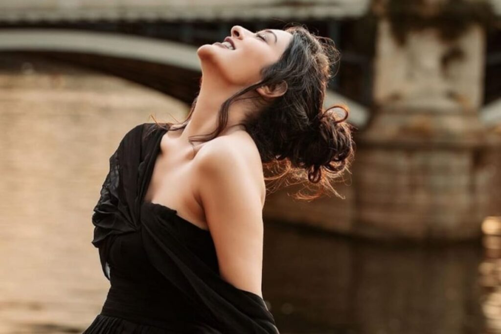 Actress Payal Rajput Exudes Class In Black Flowy Thigh-high Slit Dress