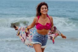 Shriya Saran Looks Stunning In Pink Bikini Top And Blue Denim Shorts On Kovalam Beach