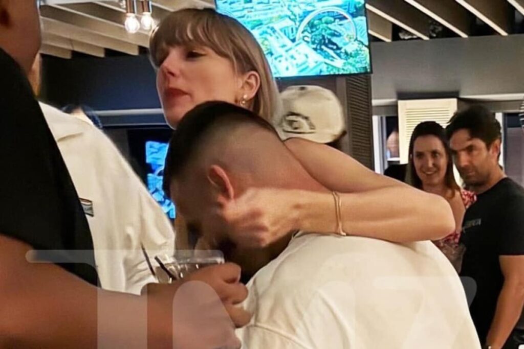 Taylor Swift Wraps Her Arm Around Rumoured Beau Travis Kelce In New Photos