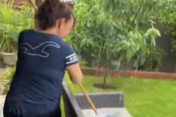 Woman Washing Sofa And Rugs With Hurricane Water Is The Ultimate Cleaning Hack