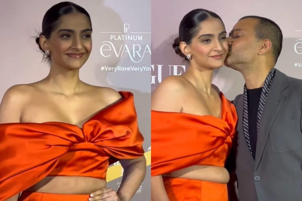 Sonam Kapoor Blushes As Anand Ahuja Kisses Her on Red Carpet, Slays in Orange Outfit; Watch
