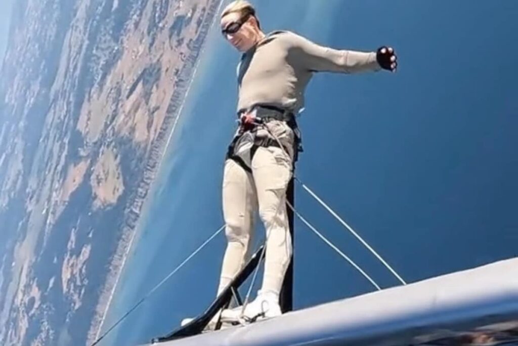 Man's Daredevil Stunt On A Moving Plane Isn't For Faint-Hearted