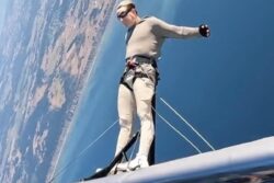 Man's Daredevil Stunt On A Moving Plane Isn't For Faint-Hearted