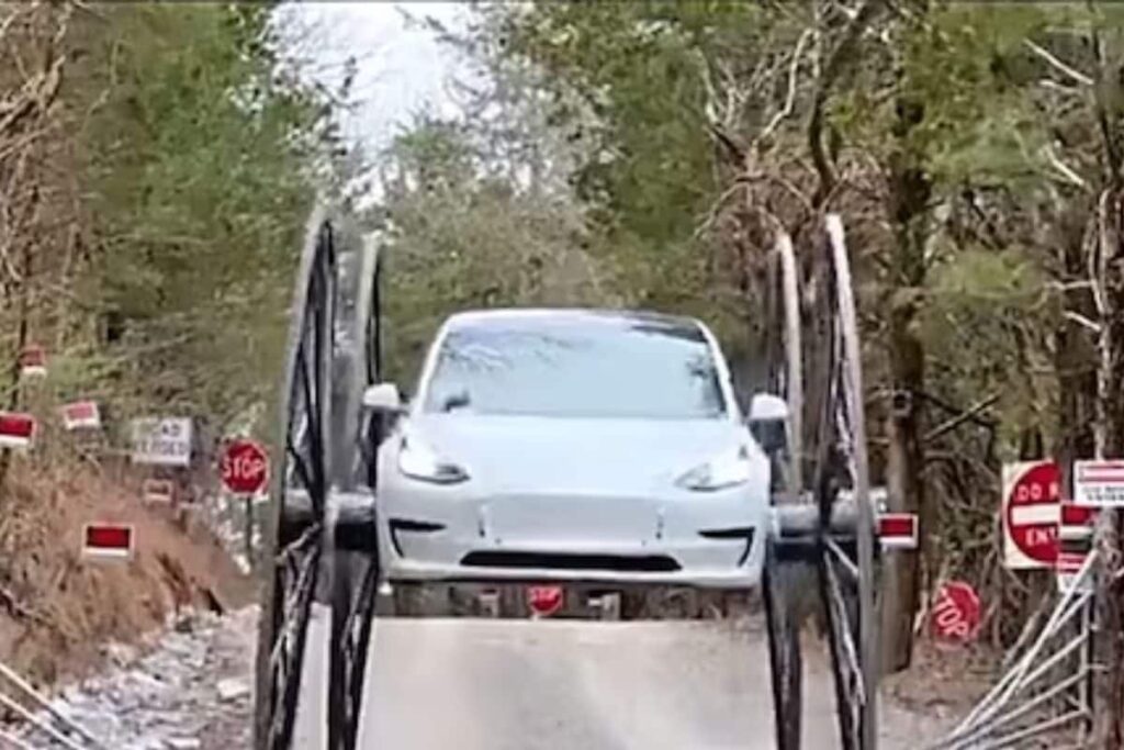 Watch: Man Drives Tesla Car Upside Down On Four 10-foot Buggy Wheels