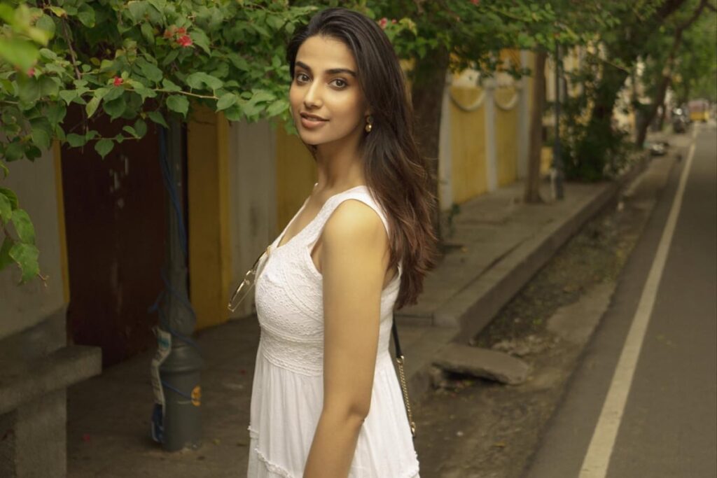 Actress Meenaakshi Chaudhary Raises Temperatures In Sleeveless White Dress