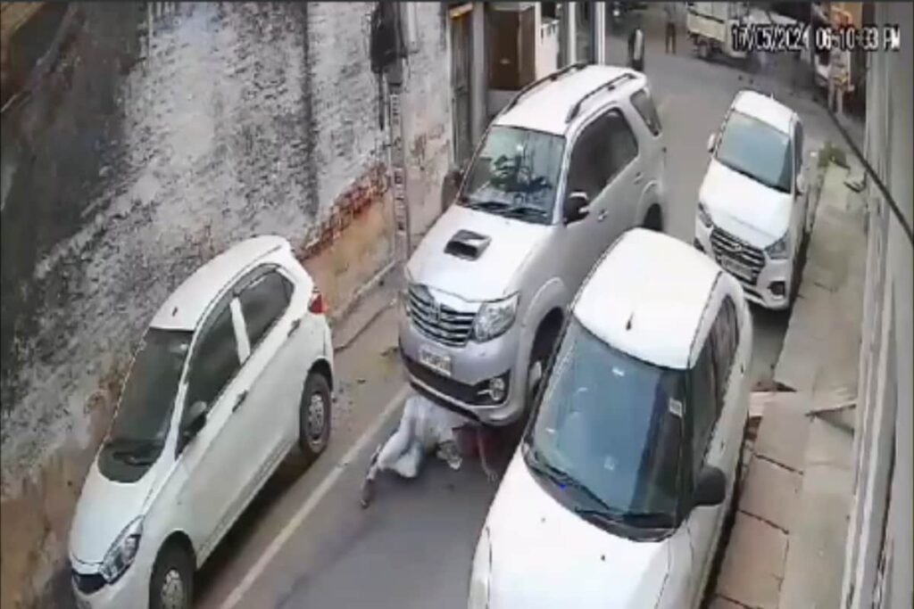 UP Man Runs Over Elderly Man Twice While Reversing SUV In Jhansi | Video
