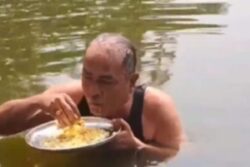 Bengal Man Eats Rice In Pond Amid Scorching Heat