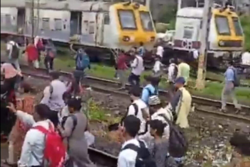 Mumbai Commuters Take To Walking On Tracks To Reach Office After Local Train Service Fails | WATCH