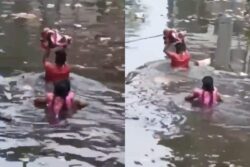 Submerged In Floodwater Till Neck, UP Parents Carry Baby Overheard To Safety | Video